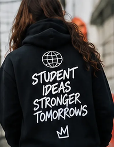 Student seen from behind wearing a black hoodie printed STUDENT IDEAS STRONGER TOMORROWS.